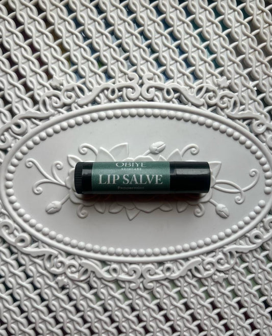 ÓBÍYÉ Lip Salve on tray in sunlight